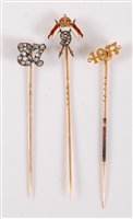 Lot 2546 - Three diamond set stick pins: a 9th Queen's...