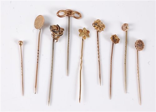 Lot 2550 - Nine stick pins: to include a 15ct stick pin;...