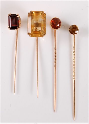 Lot 2551 - Four gemset stick pins: to include an...