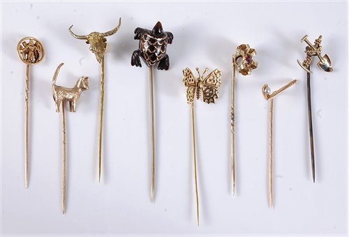 Lot 2553 - Eight various stick pins: a 9ct cat stick pin,...