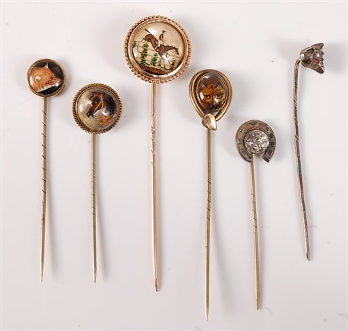 Lot 2554 - Six stick pins of sporting interest: to...