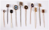Lot 2557 - Ten various stick pins: to include garnet,...