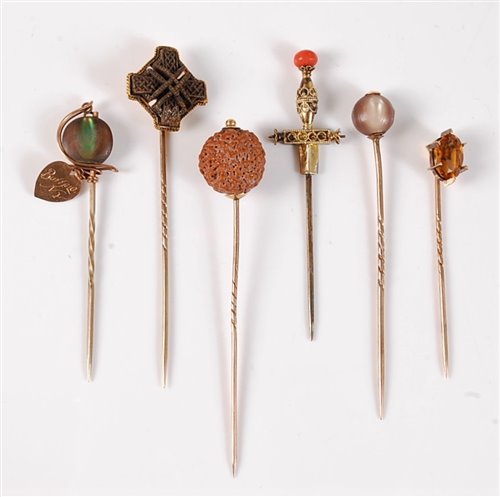 Lot 2559 - Six various stick pins: to include a Celtic...