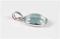 Lot 1218 - An aquamarine pendant, the oval mixed cut...