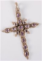 Lot 1322 - A silver and amethyst cross, the mixed cut...