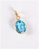 Lot 2637 - A topaz pendant, the oval faceted topaz,...