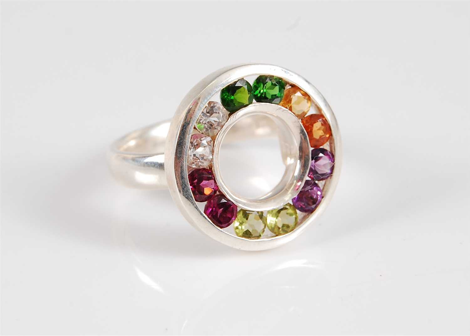 Lot 313 - A silver and multi gemset ring, the silver...