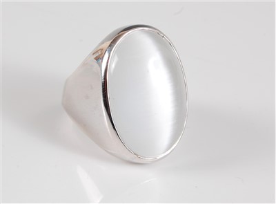 Lot 314 - A silver and moonstone ring, the oval...