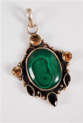 Lot 312 - A silver and gemset pendant, the central...