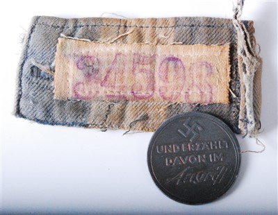 Lot 256 - A piece of cloth in the blue and white stripes on a concentration camp uniform