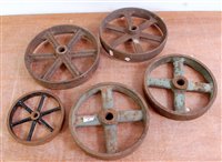 Lot 82 - Five various spoked cast iron wheels of...
