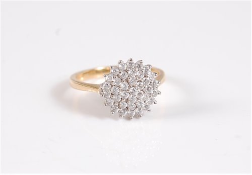 Lot 2647 - An 18ct diamond cluster ring, the round...