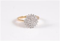 Lot 2647 - An 18ct diamond cluster ring, the round...
