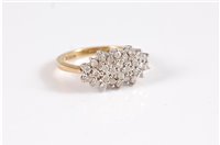 Lot 2655 - An 18ct oval diamond cluster ring, the oval...