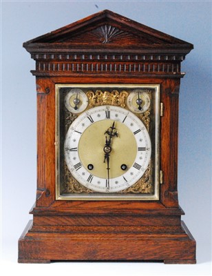 Lot 1545 - A circa 1900 German oak cased bracket clock,...