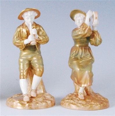 Lot 1094 - A pair of Royal Worcester shot enamel figures,...