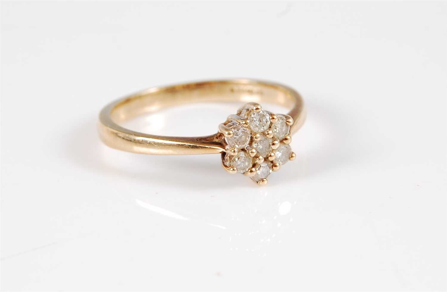Lot 306 - A 9ct diamond cluster ring, the flowerhead...