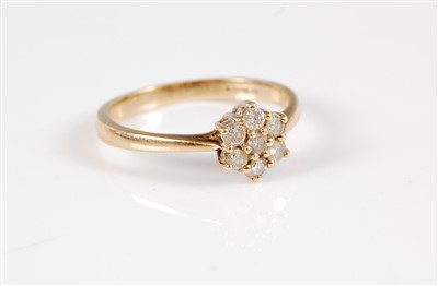Lot 306 - A 9ct diamond cluster ring, the flowerhead...