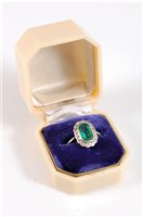 Lot 1260 - A platinum emerald and diamond ring, the...