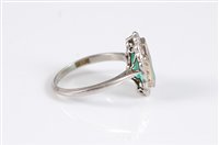 Lot 1260 - A platinum emerald and diamond ring, the...