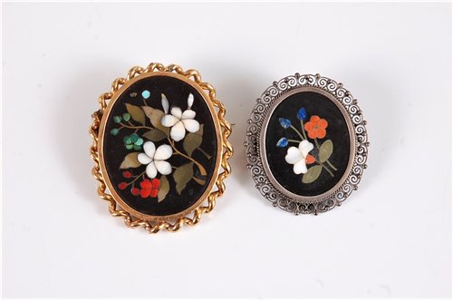 Lot 2586 - Two pietra dura brooches, the first oval...
