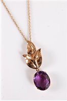 Lot 2582 - A 9ct amethyst pendant, the oval faceted...