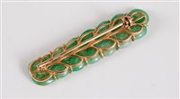 Lot 1286 - A jade brooch, the jade carved as a sprig of...
