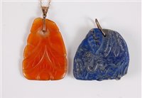 Lot 1285 - Two carved pendants, the first a carnelian...
