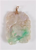 Lot 1287 - A Chinese carved jade pendant, the...