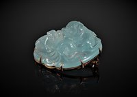 Lot 1284 - A Chinese carved aquamarine brooch, the off...