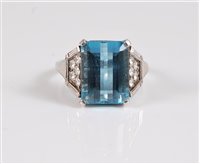 Lot 1241 - An aquamarine and diamond ring, the step cut...
