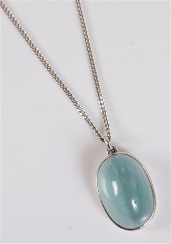 Lot 1256 - A cats eye aquamarine pendant, the oval...