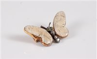 Lot 1251 - A 15ct gemset and diamond white butterfly...