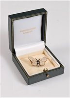 Lot 1251 - A 15ct gemset and diamond white butterfly...