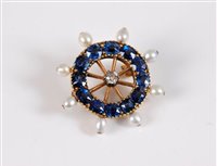 Lot 1228 - A sapphire, diamond and 'pearl' Captains wheel...