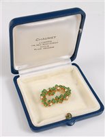 Lot 1323 - An emerald and diamond brooch by Chaumet, the...