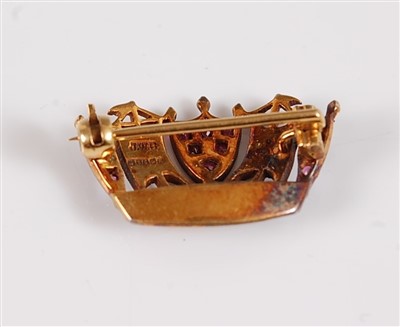 Lot 1221 - A 9ct ruby and seed pearl naval crown brooch,...