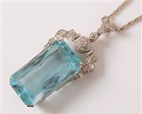 Lot 1217 - An Art Deco aquamarine and diamond pendant,...