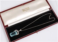 Lot 1217 - An Art Deco aquamarine and diamond pendant,...