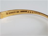 Lot 258 - A 14ct gold torque bangle by Bent Gabrielsen...