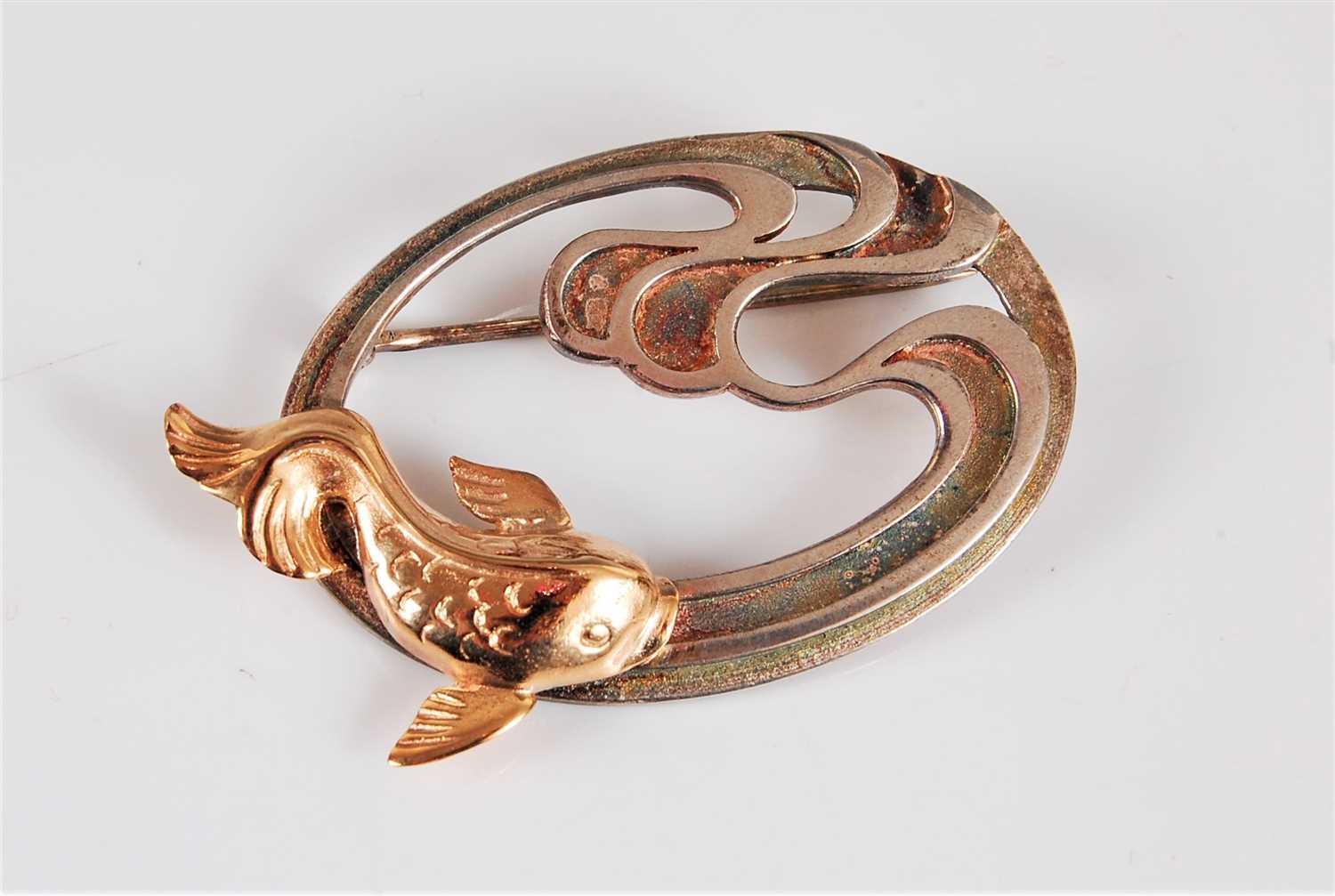 Lot 342 - A silver gilt fish brooch, the koi style fish...
