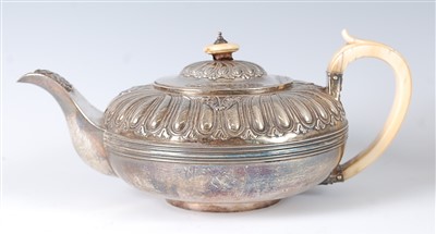 Lot 1188 - A late Georgian silver teapot, of squat...