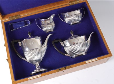 Lot 1195 - A late Victorian silver four-piece tea and...