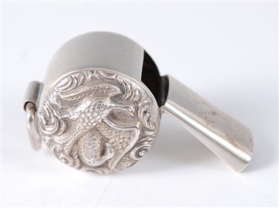 Lot 1198 - A late Victorian silver whistle, the sides...