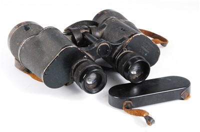 Lot 230 - A pair of WW II German Dienstglas 10 x 50 binoculars no. 2209628, with bakelite lens covers.