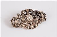Lot 1320 - A 19th century diamond brooch, the central...