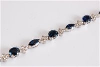Lot 1222 - An 18ct sapphire and diamond bracelet, the...