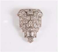 Lot 1244 - An Art Deco diamond dress clip, of stepped...