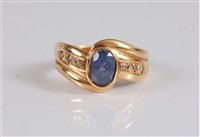 Lot 2659 - An 18ct sapphire and diamond ring, the oval...