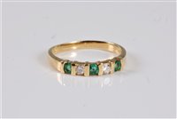 Lot 2652 - An 18ct emerald and diamond ring, the three...